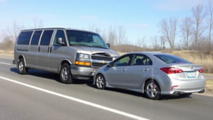 a car crashed into a van on the road