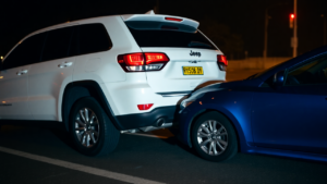 a white car with a blue car on the back