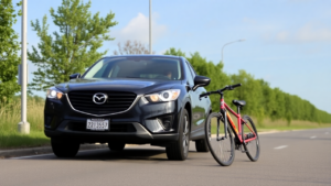 a car parked next to a bicycle