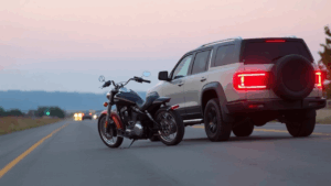 a motorcycle and car accident on the road
