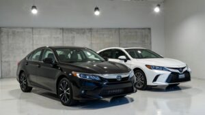 Black and white cars in showroom.