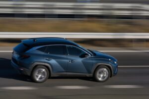 Blue SUV driving on highway