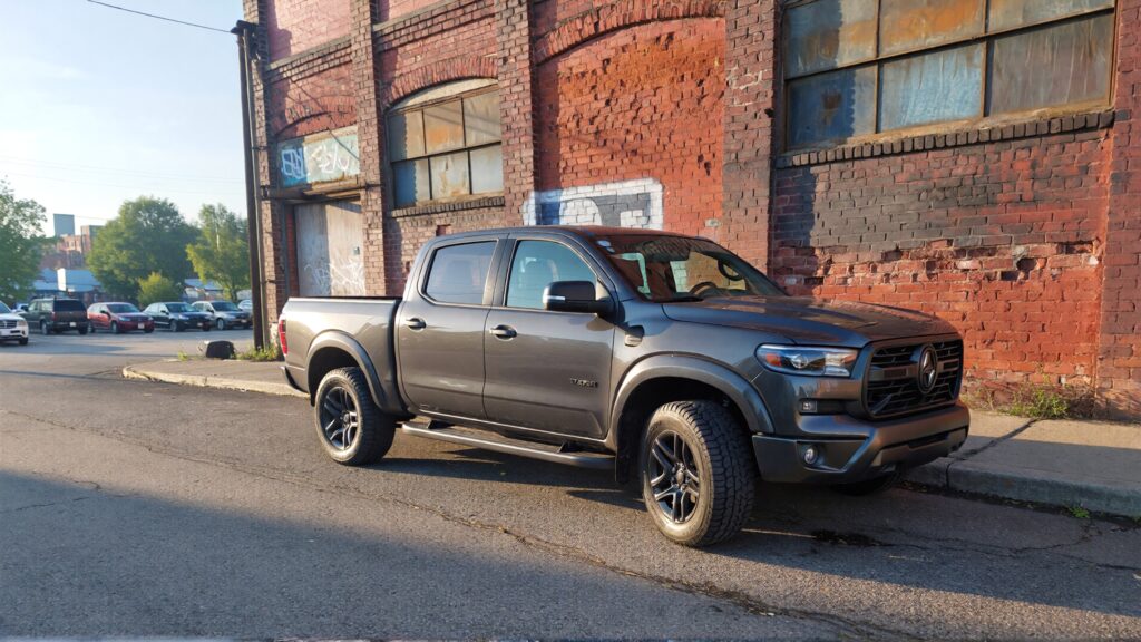 Juris Digital a gray pick up truck parked beside a building 4512a03c e077 46c0 be02 287b483df021