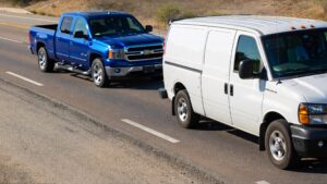 a van and a pick up on the road
