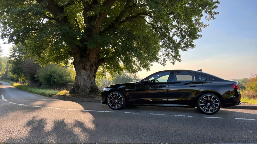 Juris digital an image of a black sedan and a tree on the road 3c8d7b8e 5273 4221 8e33 922cb51ec2d0