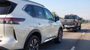 White SUV and gray pickup truck