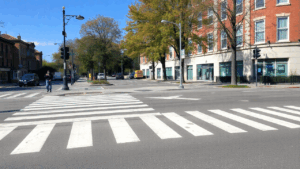 Busy street with marked crosswalk.