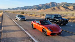Three luxury vehicles on open road