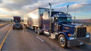 Two large trucks on highway