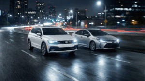 Two cars driving at night.