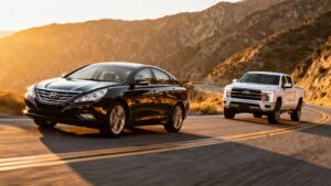Two cars driving on winding road.