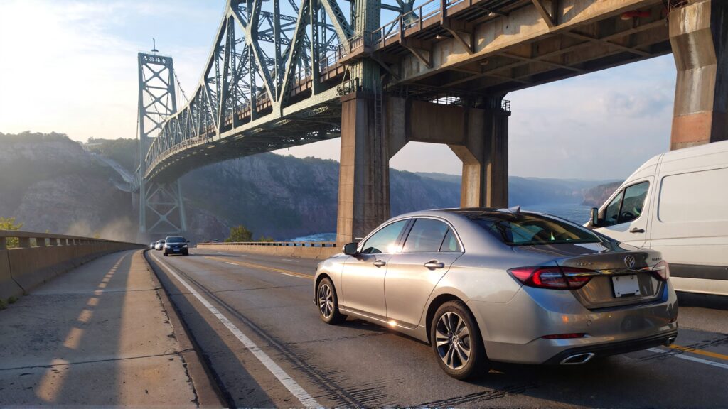 Samantha parian a silver sedan and a white van on a bridge 5fe24541 f488 4da2 9c40 7bcd8ec5a73a 1