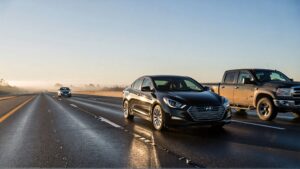 Cars driving on a wet highway