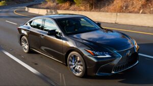 Black Lexus sedan driving on highway