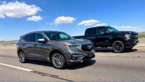 Gray SUV and black pickup truck