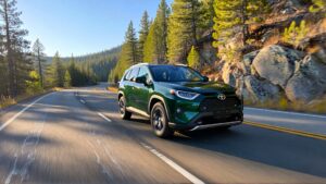 Green Toyota RAV4 driving on road