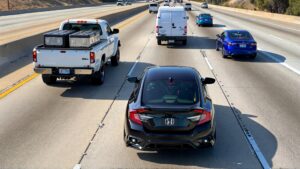 Cars driving on a busy highway.