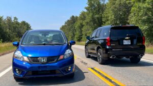 Two cars driving on a highway