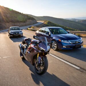 Motorcycle and cars on winding road