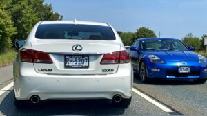 White Lexus and blue Nissan cars