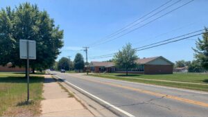 Elementary school beside a quiet road.