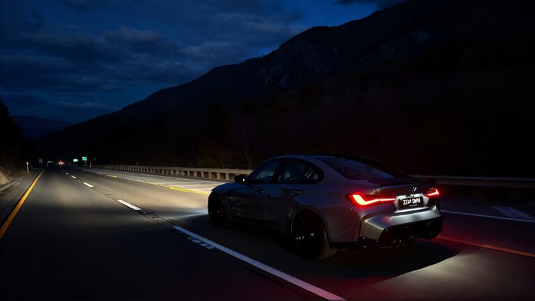 Juris digital a 2024 BMW M3 on the highway near a mountain at night d230ce1d a71f 4708 bf92 fa32be53155b