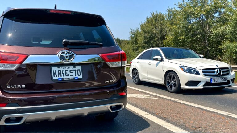 Juris digital a Toyota Highlander and a white Mercedes sedan on the road 4b54670f 14f3 4fec b24f 5ea77ef4bb04 1