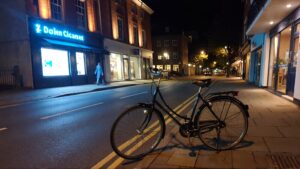Bicycle parked on a quiet street.