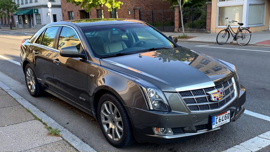 Juris digital a gray Cadillac CTS a bicycle on the street in the morning d6dbc197 e6a8 41aa 927a dba7c0de69b8