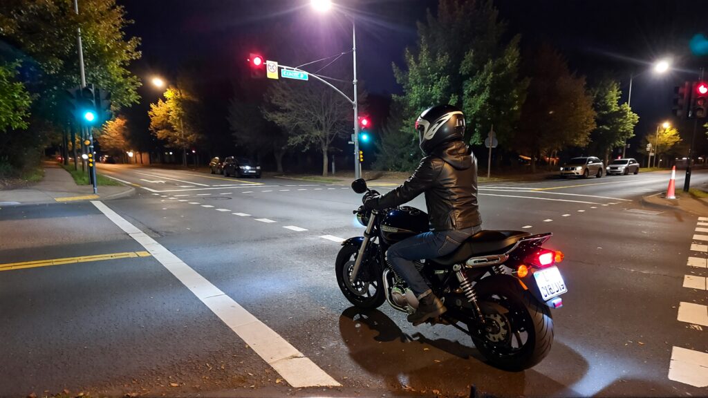 Juris digital a motorcycle in an intersection at night time 8d2598c1 ae2e 43cc 8a3d 64e2ce8389b2