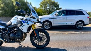 Motorcycle and SUV on the road