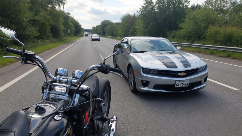 Samantha parian a Chevrolet Camaro and a motorcycle on the highway put no perso 531fa474 dfa9 400e 998e 714577541c69