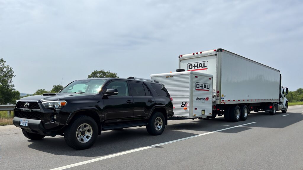 Samantha parian a Toyota 4Runner towing a U Haul trailer and a 30 foot box truck 8f7313ef ca7b 4bb9 9238 40ac3e0fa896
