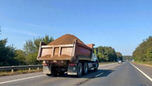 Dump truck driving on highway
