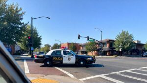 Police car at traffic intersection.