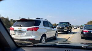 Traffic with multiple Chevrolet vehicles.