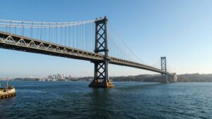 Bay Bridge over calm blue waters.