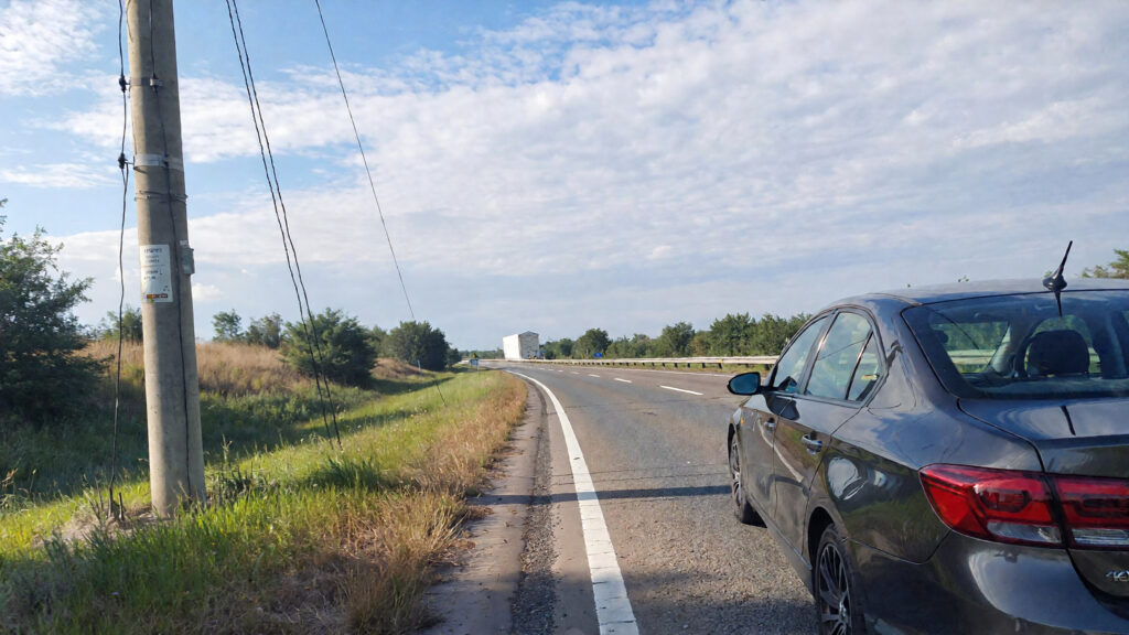 Samantha parian a car near a power pole on the highway 98c0a793 baa6 4b9b adb0 7be24333bebf