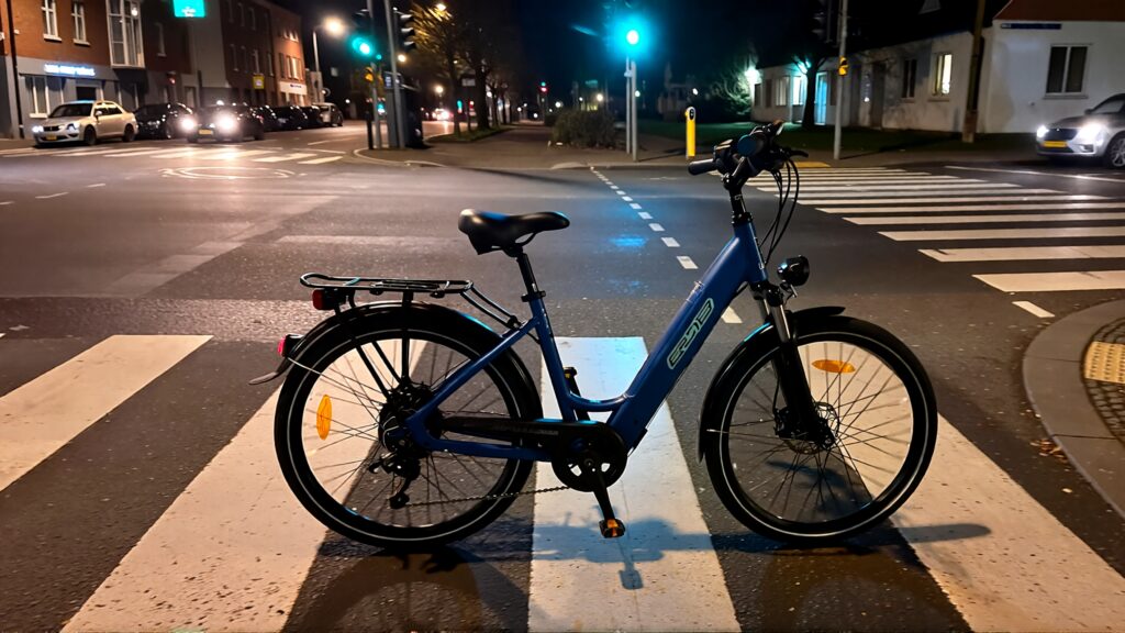 Samantha parian an electric bike in a street intersection at night with no person b119ea35 cb83 41f2 bd9a e29261be7b73