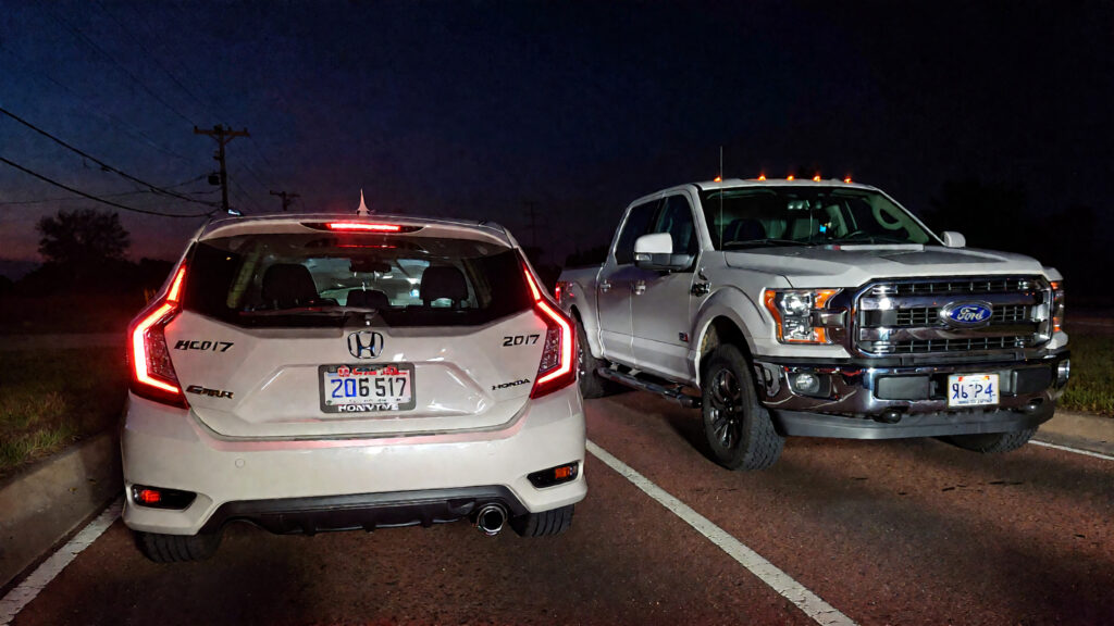 Samantha parian a 2017 Honda Civic and a Ford F 150 pickup truck on the road at n 5306c778 e803 4224 a89e 930ee0376ca1