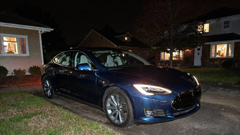 Samantha parian a tesla near a residential area at night time a3739baf a637 4893 8804 9c9d995dfcc8