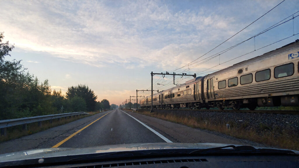Samantha parian a train on the road at dawn f25bc27a 57c3 43e9 a681 ee17b406fbd3