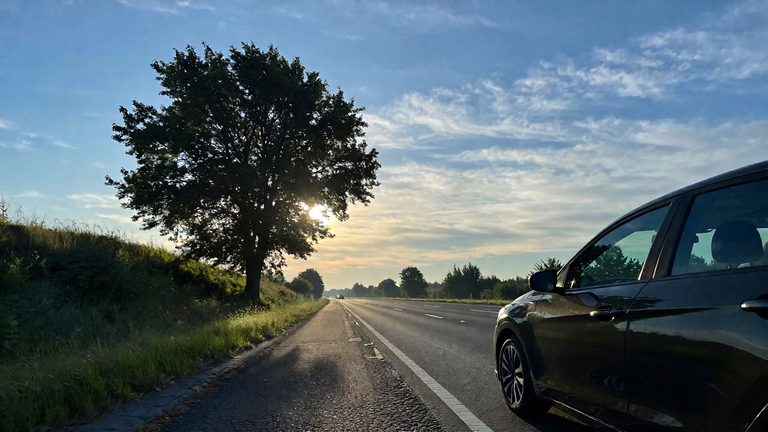 Car parked beside a quiet road